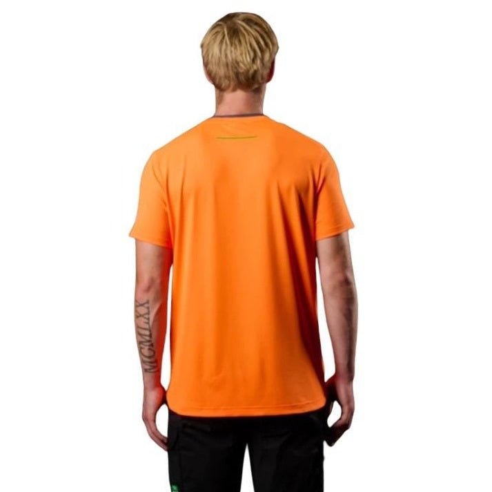 Person wearing an orange shirt with a logo on the back, standing against a white background