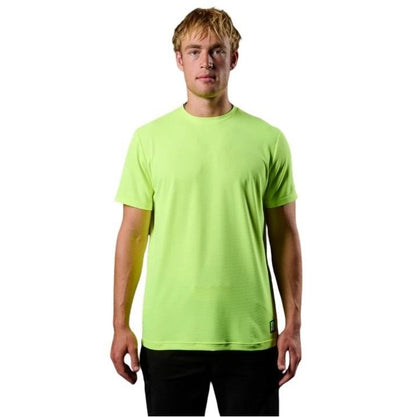 Man wearing a bright green t-shirt on a white background