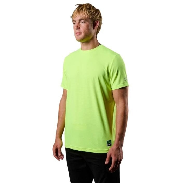 Person wearing a bright green t-shirt on a white background