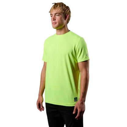 Person wearing a bright green t-shirt on a white background