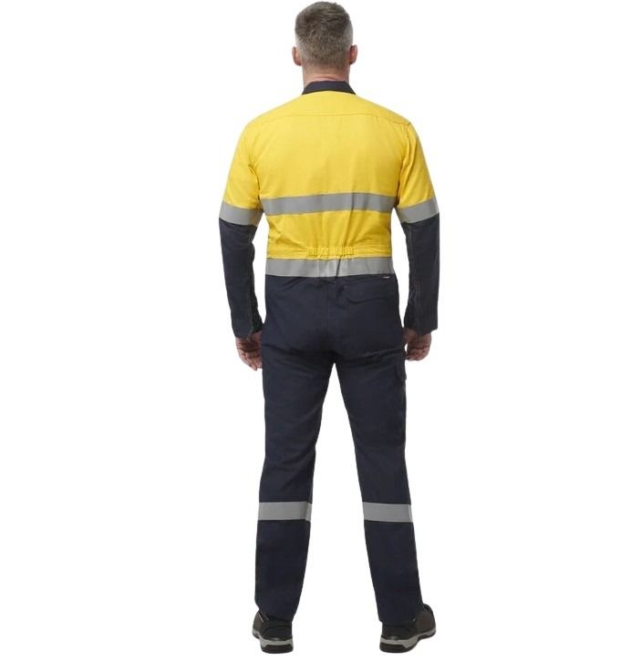 Person wearing a yellow and navy work uniform with reflective stripes on a white background