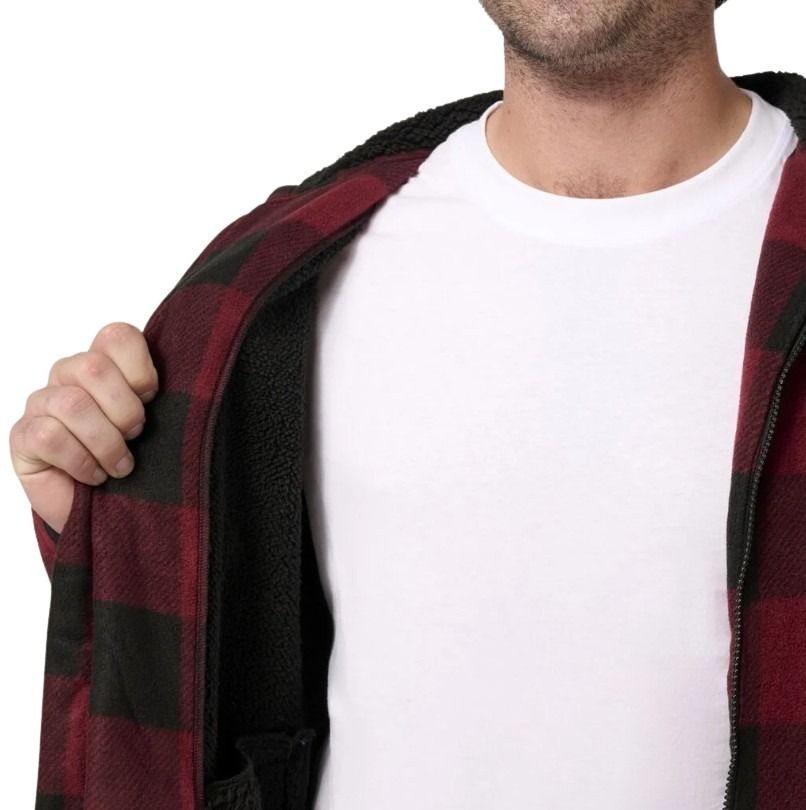Person wearing a red and black checkered jacket over a white shirt on a white background