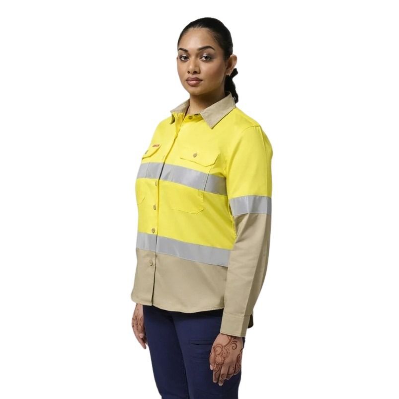 Person wearing a yellow and beige high-visibility work shirt on a white background
