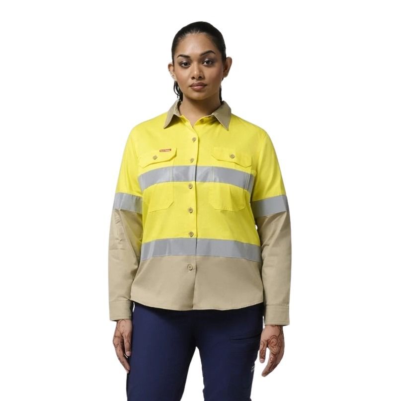 Person wearing a yellow and beige high-visibility work shirt on a white background