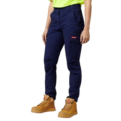 Navy pants with a red label worn by a person on a white background